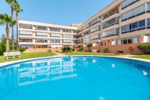 a large swimming pool in front of a building at Vistamarina A309 By IVI Real Estate in Torremolinos