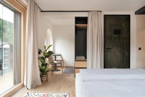 Letto o letti in una camera di Grand Pension Franziska - inkl CrossFit Gym