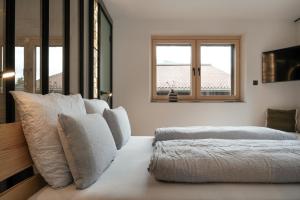 Letto o letti in una camera di Grand Pension Franziska - inkl CrossFit Gym