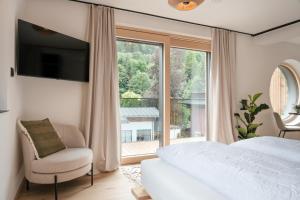 Letto o letti in una camera di Grand Pension Franziska - inkl CrossFit Gym