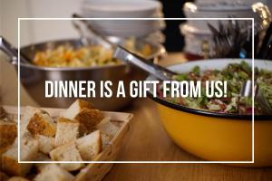a dinner is a gift from us with a bowl of food at Jungle Jaffa Hostel Age 18 to 45 in Tel Aviv