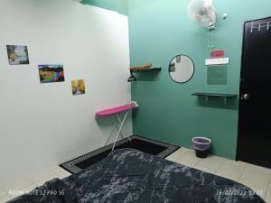 a hospital room with a bed in the corner of a room at Cinoiva Homestay Gambang, Kuantan in Gambang
