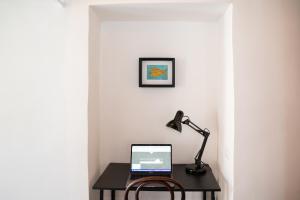 A television and/or entertainment centre at Palazzo Attila - Gioia Apartments