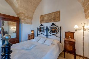 Postel nebo postele na pokoji v ubytování Masseria li Vecchi