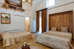 Postel nebo postele na pokoji v ubytování Masseria li Vecchi