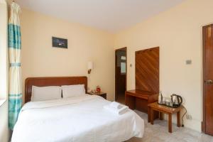 Postel nebo postele na pokoji v ubytování Hotel Sherwi Hyul