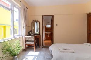 Postel nebo postele na pokoji v ubytování Hotel Sherwi Hyul