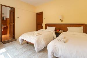 Postel nebo postele na pokoji v ubytování Hotel Sherwi Hyul