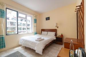 Postel nebo postele na pokoji v ubytování Hotel Sherwi Hyul