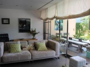 a living room with a couch and a table at Homing Golf Bonmont 12 in Bonmont Terres Noves