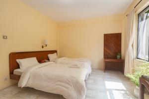 Postel nebo postele na pokoji v ubytování Hotel Sherwi Hyul