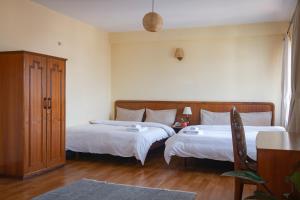 Postel nebo postele na pokoji v ubytování Hotel Sherwi Hyul