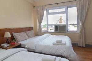 Postel nebo postele na pokoji v ubytování Hotel Sherwi Hyul