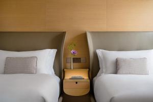 Letto o letti in una camera di Regent Hong Kong