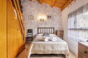 Tempat tidur dalam kamar di Casa Batlle Ginebro