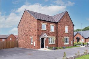 a brick house with a black roof at Charming 2 Bed Home in Edwalton in Nottingham