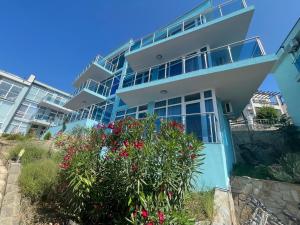 a large building with flowers in front of it at Villa Mare Blu in Sozopol