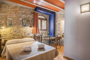 Cama o camas de una habitación en Mossen Batista Faig