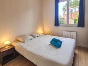 Ένα ή περισσότερα κρεβάτια σε δωμάτιο στο Cosy'Appart - LE SAINT MAUR