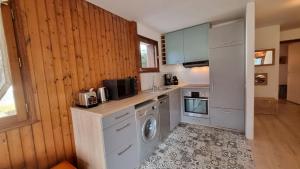 Kuchyňa alebo kuchynka v ubytovaní Appartement Érable