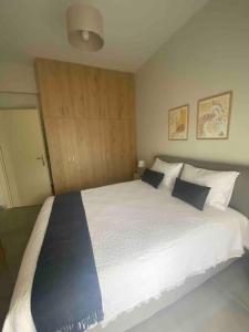 Ένα ή περισσότερα κρεβάτια σε δωμάτιο στο Didima apartment +4 φωτογραφίες