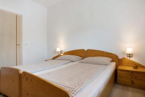 Llit o llits en una habitació de Residence zum Roessl 205