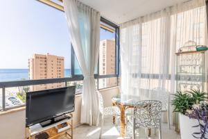TV a/nebo společenská místnost v ubytování Apartamento Paraíso Florida