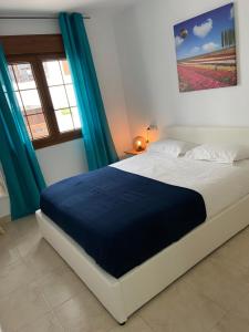 Posteľ alebo postele v izbe v ubytovaní Casa Bello
