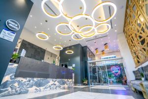 a lobby of a store with a large chandelier at The Gate Kadıköy Downtown in Istanbul