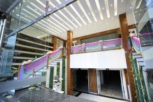 a stage in a building with a sign on it at hotel the lilli villas in Alambagh