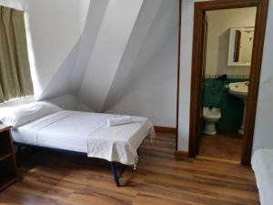 Postel nebo postele na pokoji v ubytování Hello Astur Green