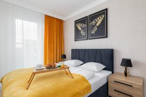 Posteľ alebo postele v izbe v ubytovaní Green Square Apartments Świnoujście by Noclegi Renters