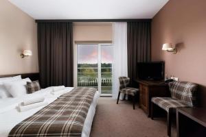 Posteľ alebo postele v izbe v ubytovaní The Amber Business & Spa Hotel