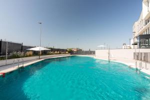 a swimming pool on the roof of a building at Be Casa - Rivas in Rivas-Vaciamadrid