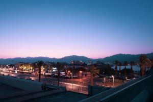 a view of a city at night at YalaRent New Sea side resort apartments in Eilat