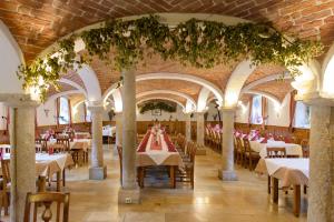 a dining room with tables and chairs in a building at Gasthaus Paulus in Neustadt an der Donau