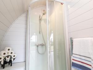 a shower with a glass door in a bathroom at Oak in Saltash