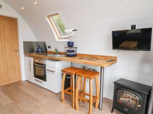 a kitchen with a counter and a sink and a stove at Ash in Saltash