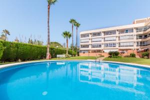 a large swimming pool in front of a building at Vistamarina A409 By IVI Real Estate in Torremolinos
