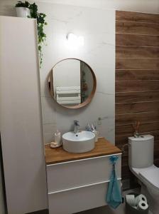 a bathroom with a sink and a mirror at Villa avec piscine privée proche Bandol/Beausset in Le Beausset