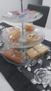 a three tiered plate of pastries on a table at La Perla in Castel San Giorgio