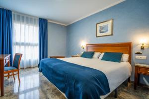 Postel nebo postele na pokoji v ubytování Hotel Bartos