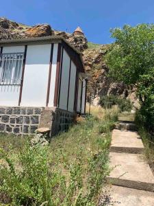 a small house on the side of a mountain at Best Sevan Villa 1 in Sevan