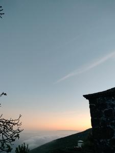 a view from the top of a mountain at sunset at Casa Rural Quinta Los Naranjos in Tigalate