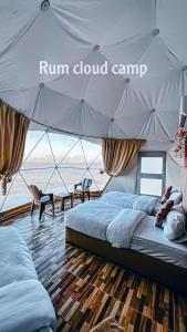 a bedroom with two beds in a tent at Rum cloud camp in Wadi Rum