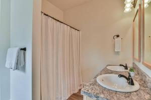 a bathroom with two sinks and a shower at Panorama Place! Comfy Asheville Retreat Sleeps 10! in Asheville