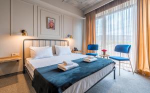Postel nebo postele na pokoji v ubytování Galavani By Vintage Hotel Collections