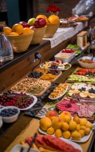 a buffet filled with lots of different types of food at Twentyone By Vintage Hotel Collections in Tbilisi City