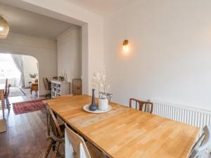 a dining room with a wooden table and chairs at 12 Westfield Terrace in Saltburn-by-the-Sea