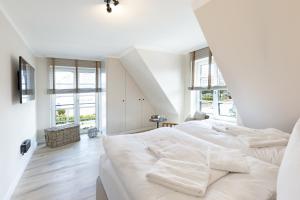 Postel nebo postele na pokoji v ubytování Strand 48